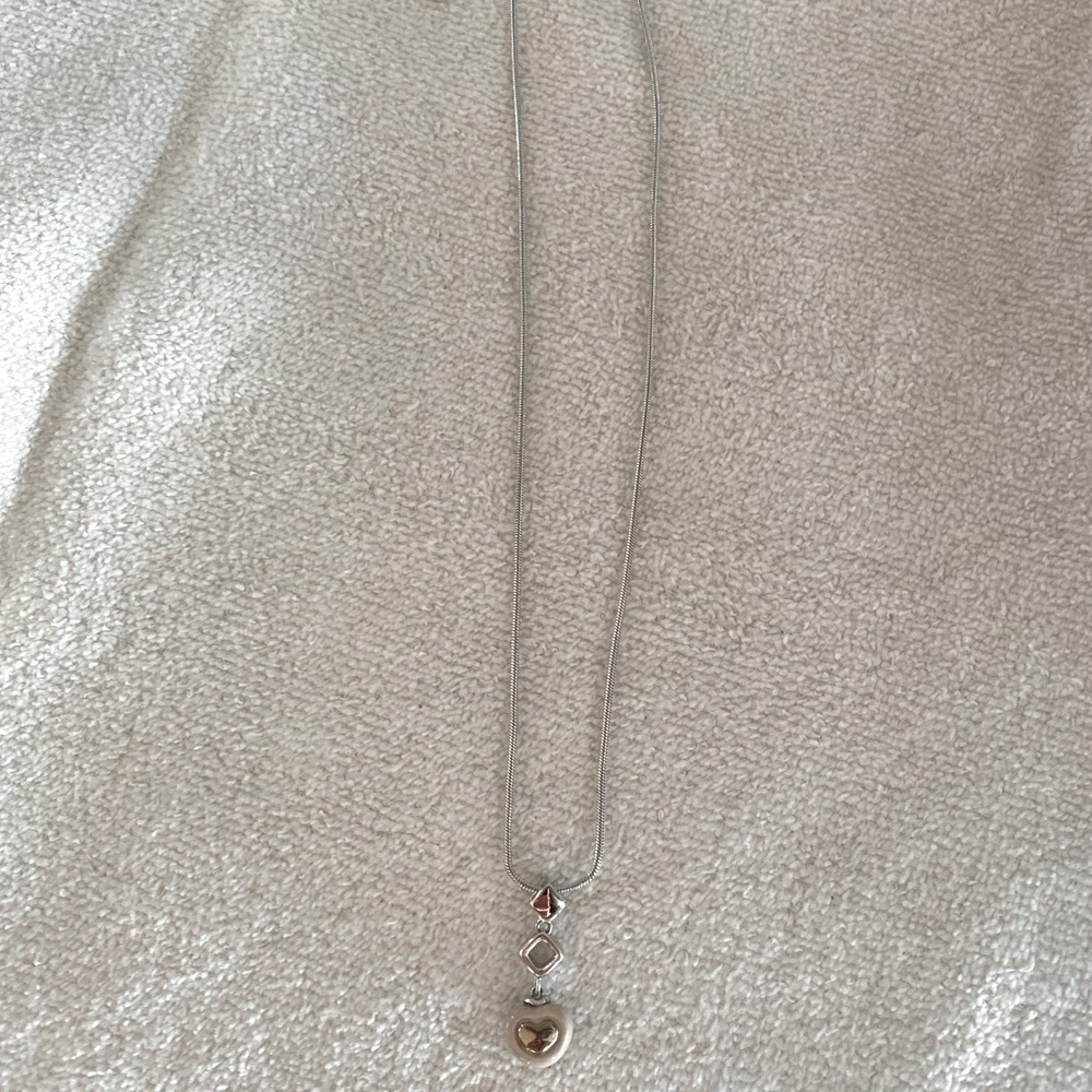 Silver necklace with heart shape charm for children